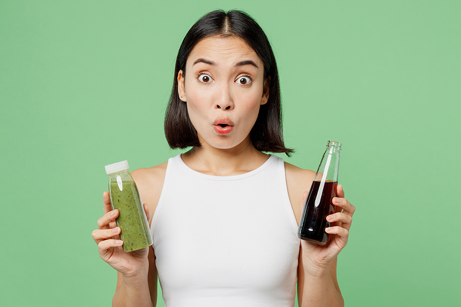 Young,Shocked,Woman,Wearing,White,Clothes,Hold,Pressed,Juice,Vegetable